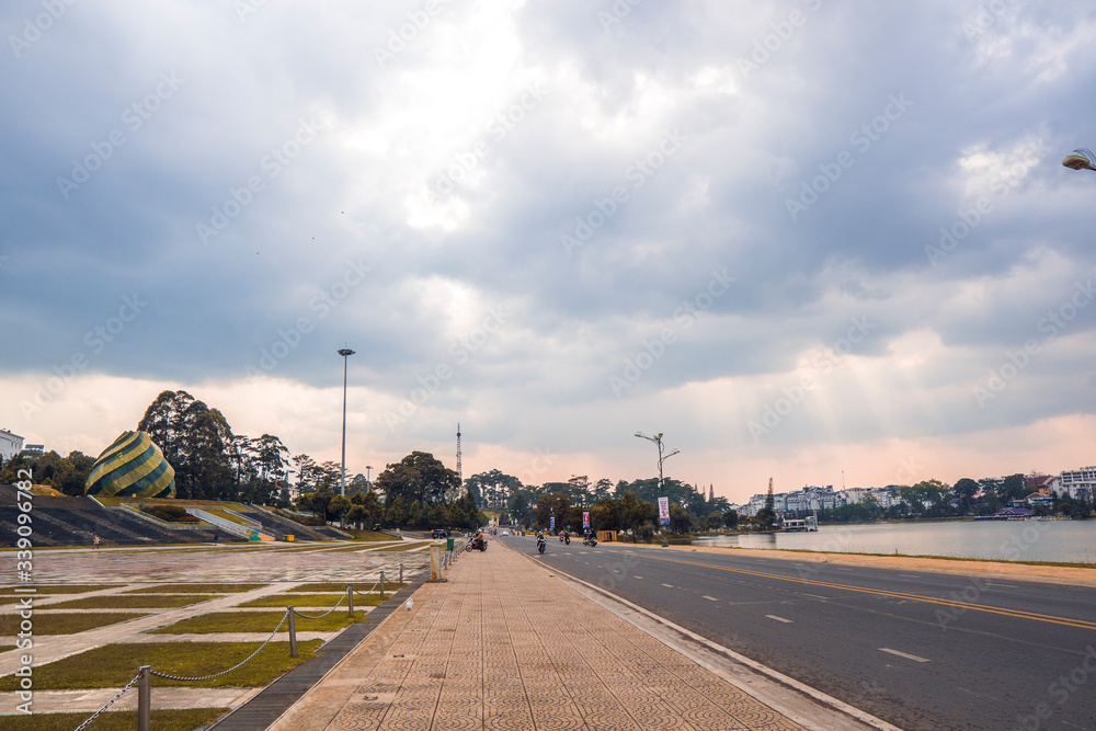 DALAT, VIETNAM - April 6, 2020: empty Sunflower Building at Lam Vien Square in Dalat, Vietnam, during Covid 19 pandemic in 2020. There are no more people. Schools, shops, restaurants, .. are closed. DALAT, VIETNAM - April 6, 2020: empty Sunflower Building at Lam Vien Square in Dalat, Vietnam, during Covid 19 pandemic in 2020. There are no more people. Schools, shops, restaurants, .. are closed.