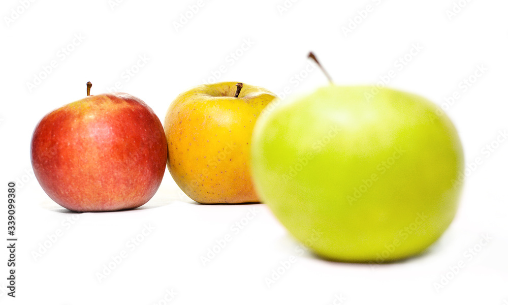 Red yellow and green apple on a white background