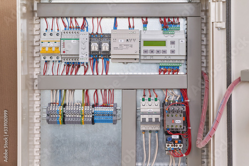 Control relay with screen, power supply, contactor or starter with thermal relay, circuit breakers, terminals, phase and voltage monitoring relays, intermediate relays in the electrical Cabinet.