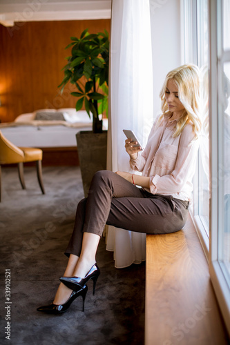 Pretty young blonde woman w...