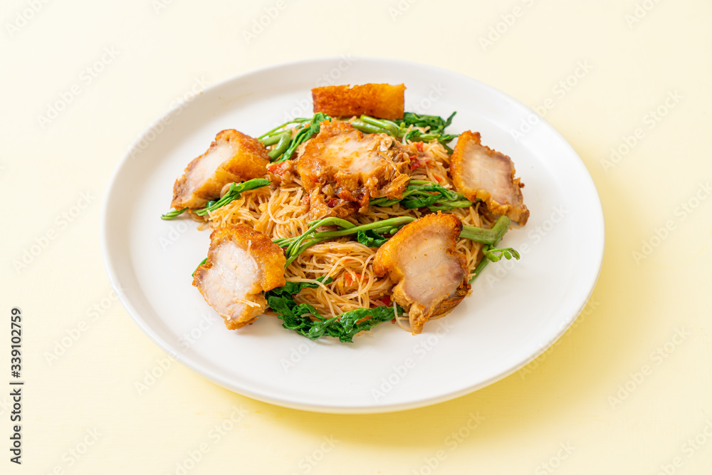 Stir-fried rice vermicelli and water mimosa with crispy pork belly