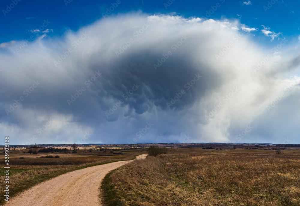 Cumulonimbus storm clouds with mammatus clouds beautiful landscape