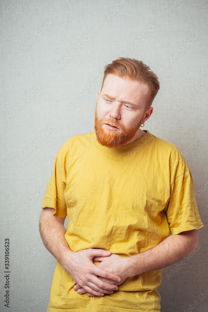 bearded man in a stomach ache bearded man in a stomach ache