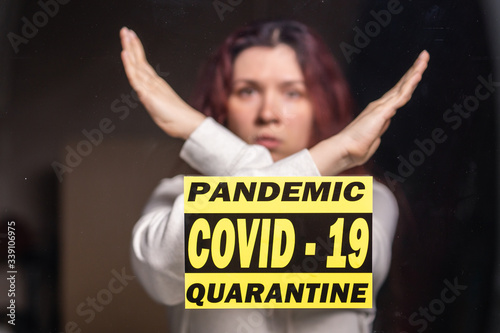 Woman showing stop gesture. Girl show gesture no. Stop coronavirus or covid-19 and the pandemic. Stay home. Quarantine concept.