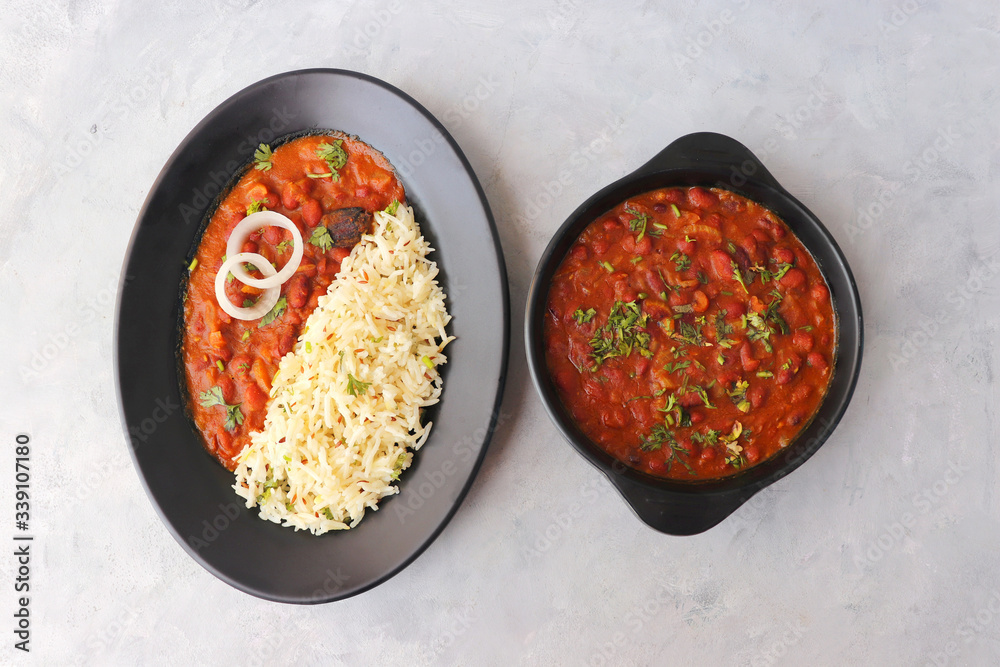 Rajma Chawal is a popular North Indian Food. Rajma is a socked Red kidney beans cooked with onions, tomatoes and a special blend of spices. Served with Jeera rice or Cumin Rice. With Copy Space.