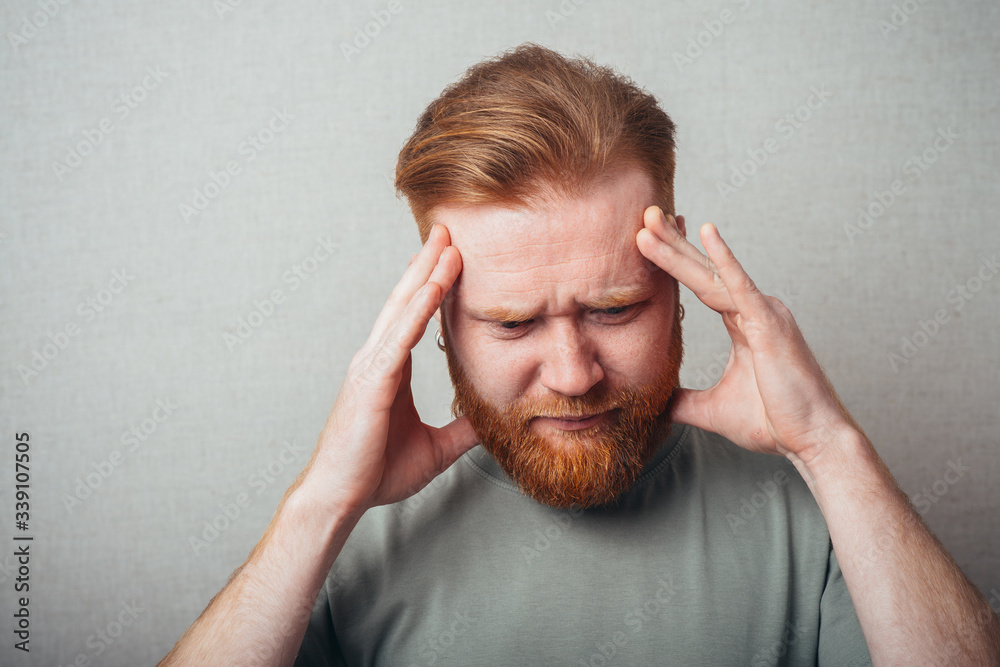 bearded man in a headache bearded man in a headache