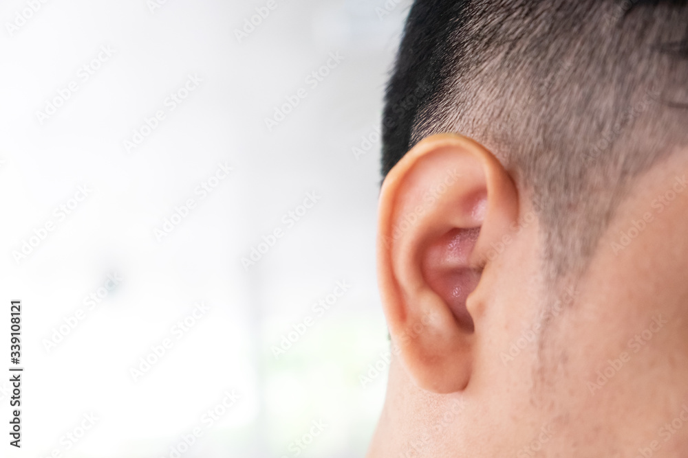 Obraz premium Close up of the right ear of a man and the place on the left side for placing letters.