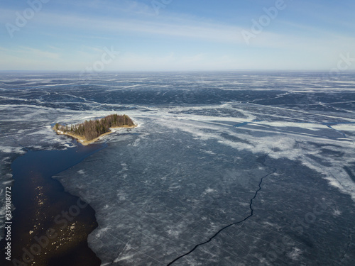 Photography Aerial view with an island on the Onega lake covered with ice, northwest of Russ