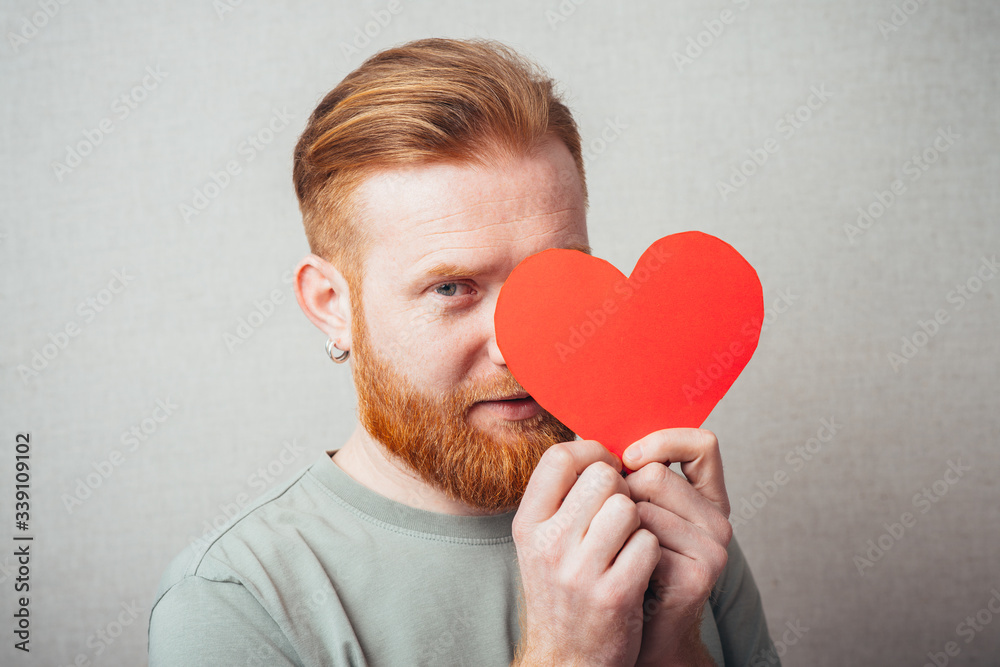 bearded man is happy and keeps the heart in the hands bearded man is happy and keeps the heart in the hands