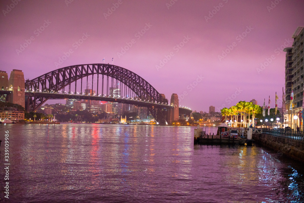 Sydney Harbour Bridge located in Sydney, NSW, Australia. Australia is a continent located in the south part of the earth.