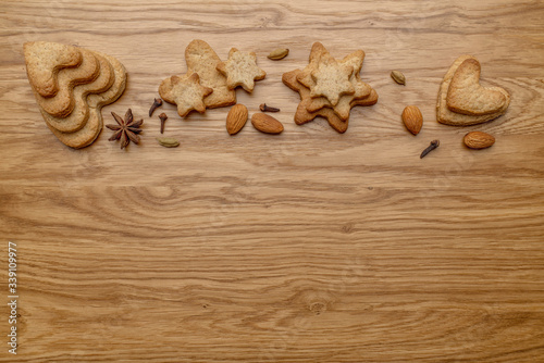Background with homemade cakes, fragrant cookies. Cookies in the form of hearts, stars, coffee beans, spices, almonds close-up. menu concept, Home baking. Full size