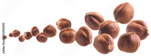 Peeled hazelnut levitates on a white background photo