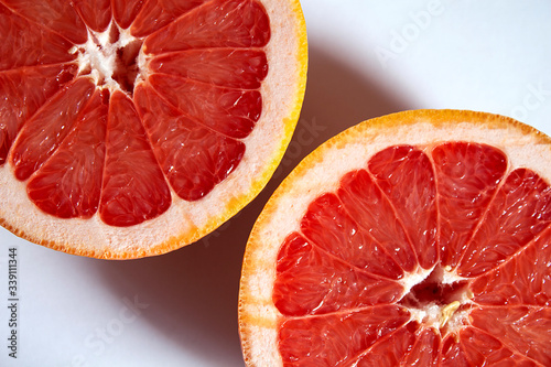 Sliced grapefruit isolated on white background