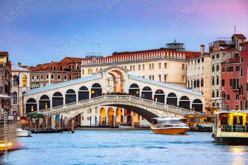 Rialto bridge on the Grand Canal at sunset, Venice, Italy