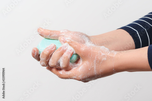 Hygiene to protect human health from viruses, hand washing with soap process. © mikhail_b_azarov