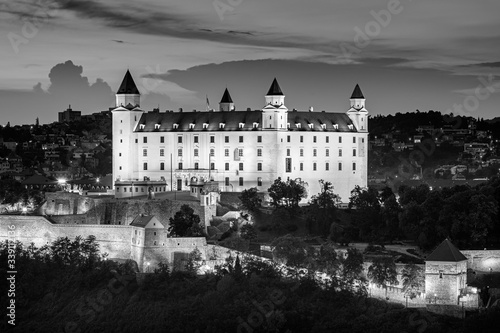 Bratislava castle over Danube river after sunset in the Bratislava old town, Slovakia