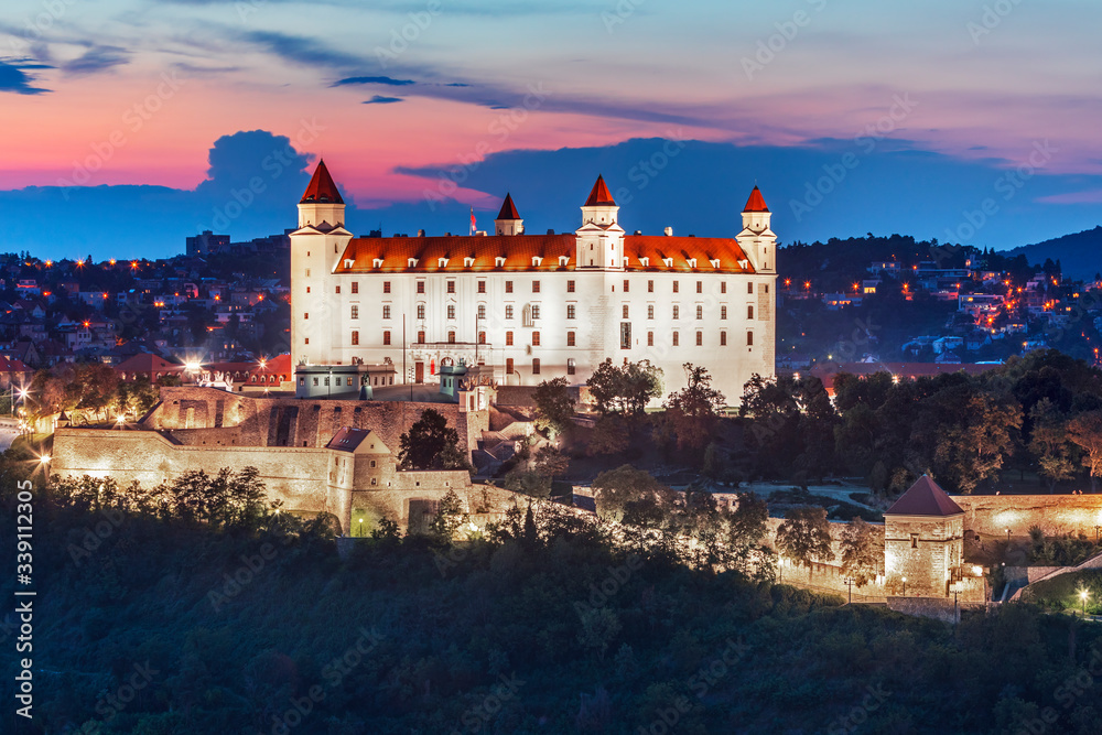 Bratislava castle over Danube river after sunset in the Bratislava old town, Slovakia