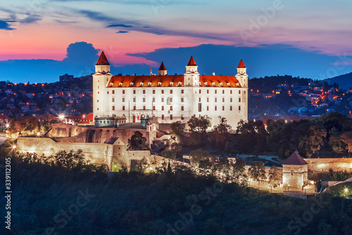 Bratislava castle over Danube river after sunset in the Bratislava old town, Slovakia