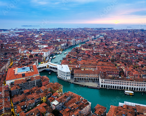 Aerial view of Rialto bridge and city at sunset, Venice, Italy