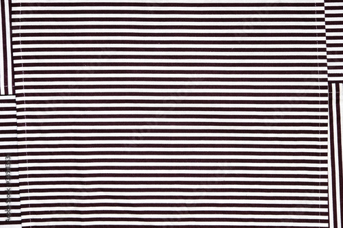 Towels and table napkins with stripes. Hypnotic design black and white.