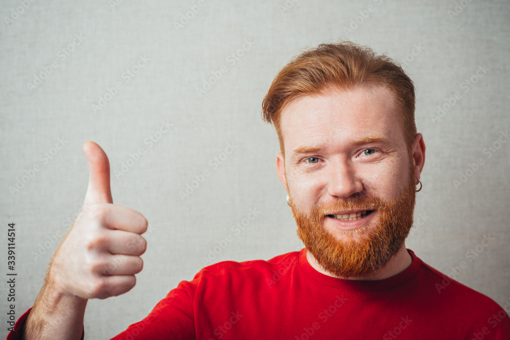 young man showing thumb up young man showing thumb up