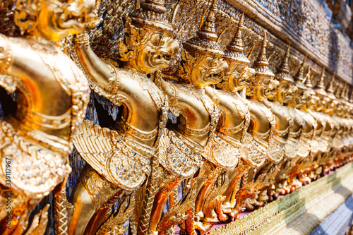Golden Garuda sculptures in a row inside temple, Bangkok photo