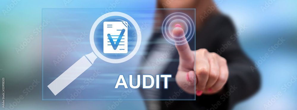 Fototapeta premium Woman touching an audit concept