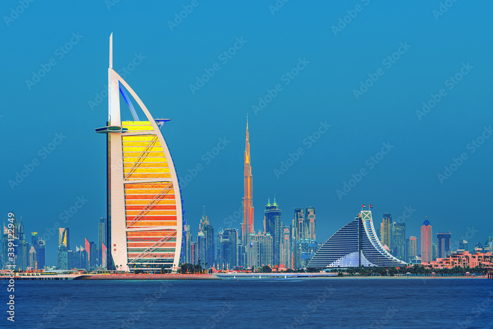 Dubai city center and famous Jumeirah beach skyline at sunset, United Arab Emirates