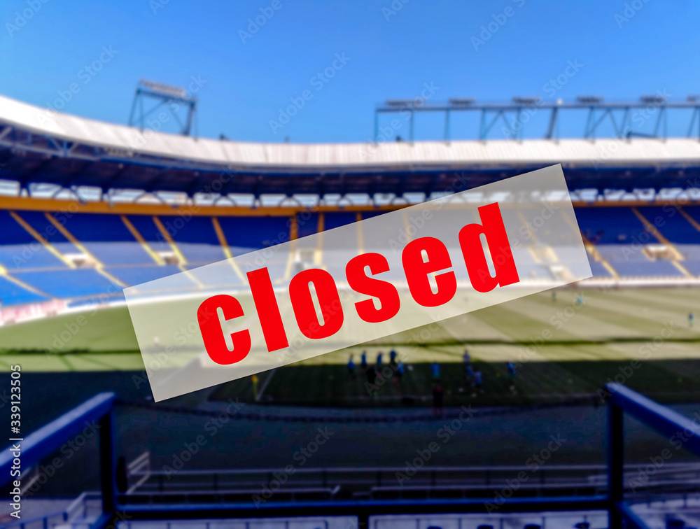 A warning sign that  the football stadiums are closed.
