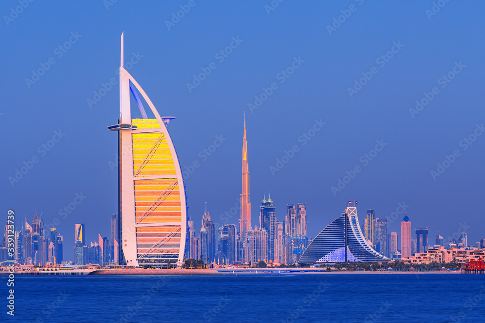 Dubai city center and famous Jumeirah beach skyline at sunset, United Arab Emirates