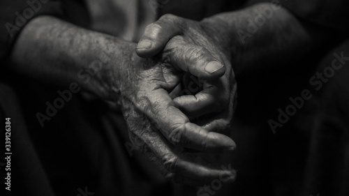 Black and white photo of elderly man's hands