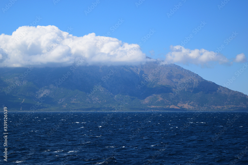 Samothraki island view from ferry - seascape with Saos mountain and coastline Samothraki island view from ferry - seascape with Saos mountain and coastline