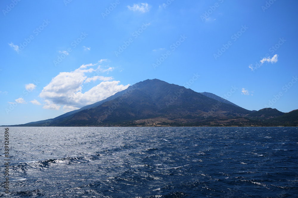 Samothraki island view from ferry - seascape with Saos mountain and coastline Samothraki island view from ferry - seascape with Saos mountain and coastline