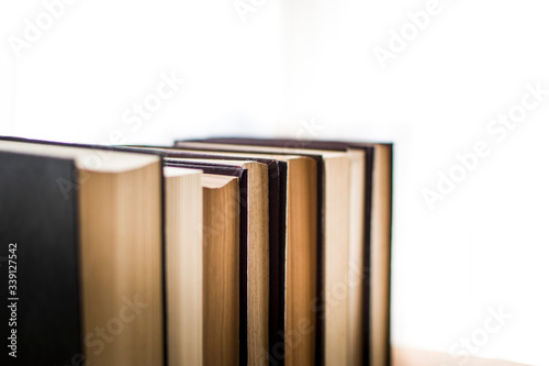 Stack of antique hard cover books