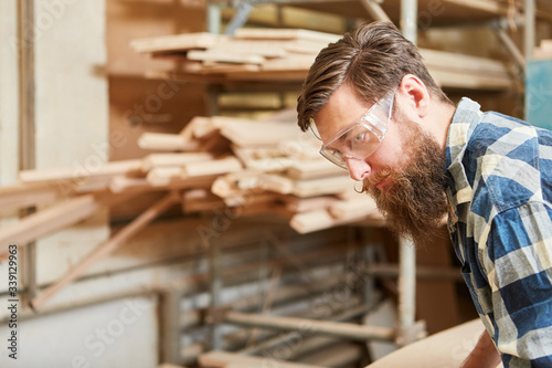 Carpenter with safety glasses