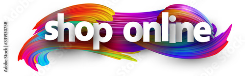 White shop online sign on brush strokes background.