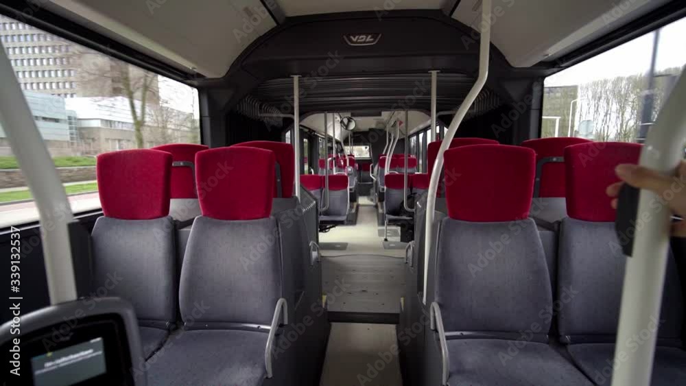 Empty Public Bus In Amsterdam During Corona Virus Pandemic - medium shot Empty Public Bus In Amsterdam During Corona Virus Pandemic - medium shot