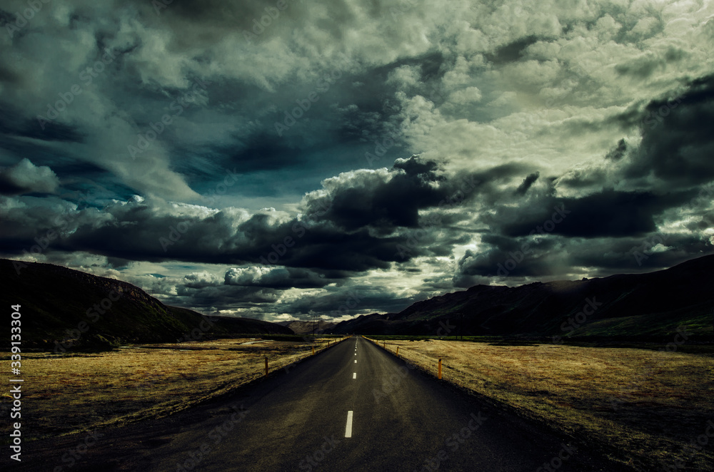 Icelandic road with impresive sky