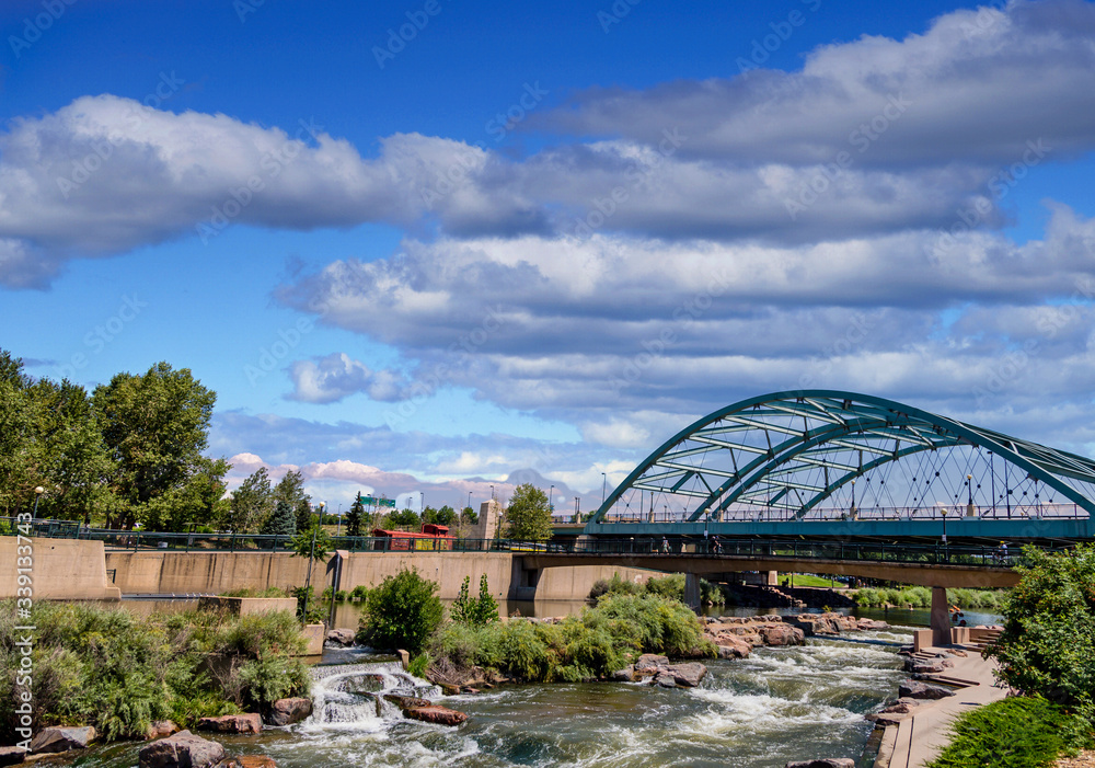 Fototapeta premium The Platte river running under a bridge in Confluence Park in Denver, Colorado