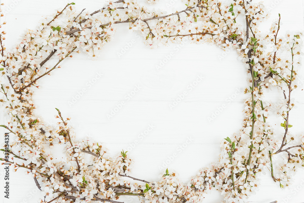 First blossom.Spring and summer white flowers on vintage wooden background.Space for your text.