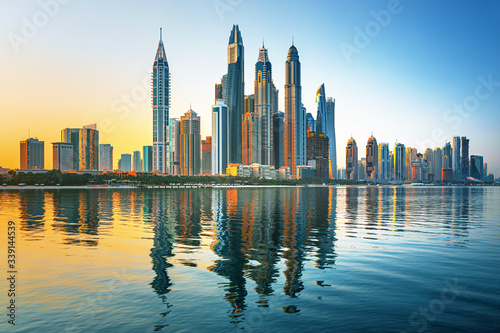 Modern and Luxury Dubai Marina with reflection - famous Jumeirah beach at sunrise  United Arab Emirates