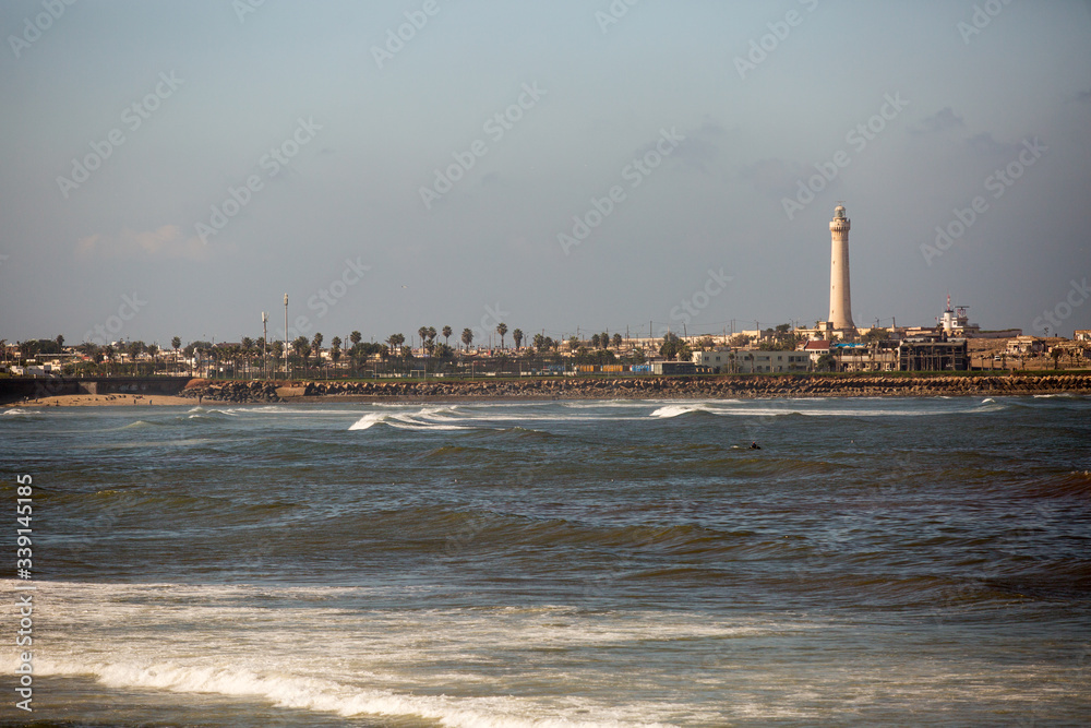 Fototapeta premium Beautiful view upon city from sea, whote harbor near beach