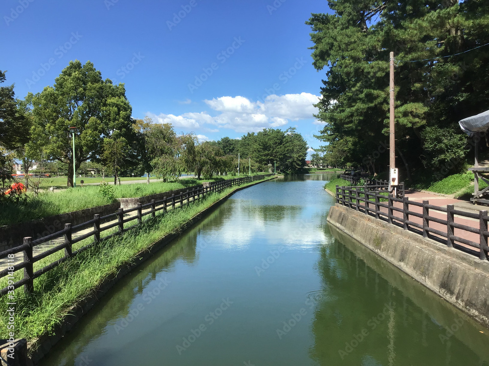 Fototapeta premium Waterway to the pond in Tennogawa Park