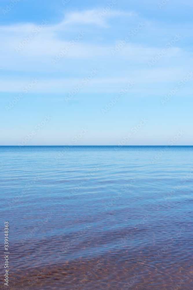 selective focus, smooth horizon line, blue lake