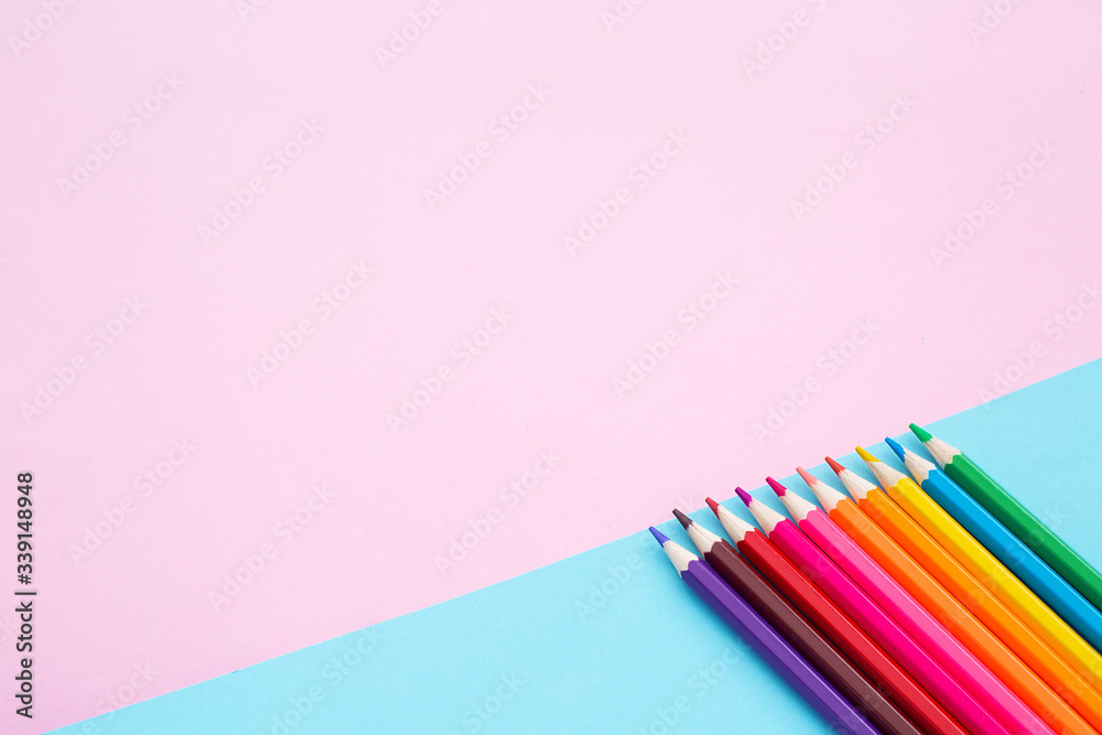 Color pencils on blue and pink background. Color pencils on blue and pink background.