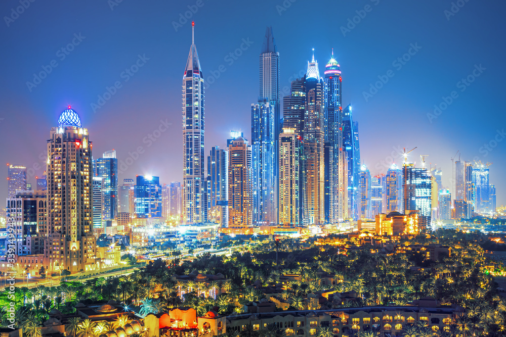 Modern and Luxury Dubai Marina with reflection - famous Jumeirah beach at sunrise, United Arab Emirates Modern and Luxury Dubai Marina with reflection - famous Jumeirah beach at sunrise, United Arab Emirates