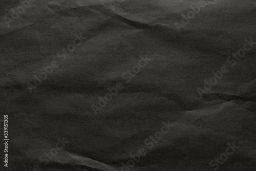 Black crumpled sheet of paper 