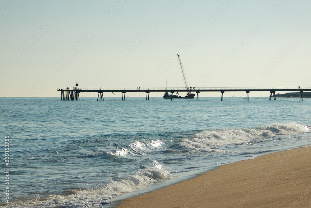 Barceloneta beach at sunrise in Barcelona, Spain
