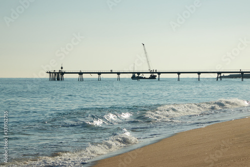 Obraz na płótnie Barceloneta beach at sunrise in Barcelona, Spain w salonie