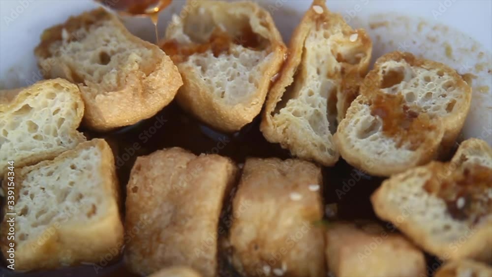 Drizzling Sauce on Fried Tofu Tahu Gejrot Indonesian Street Food Drizzling Sauce on Fried Tofu Tahu Gejrot Indonesian Street Food